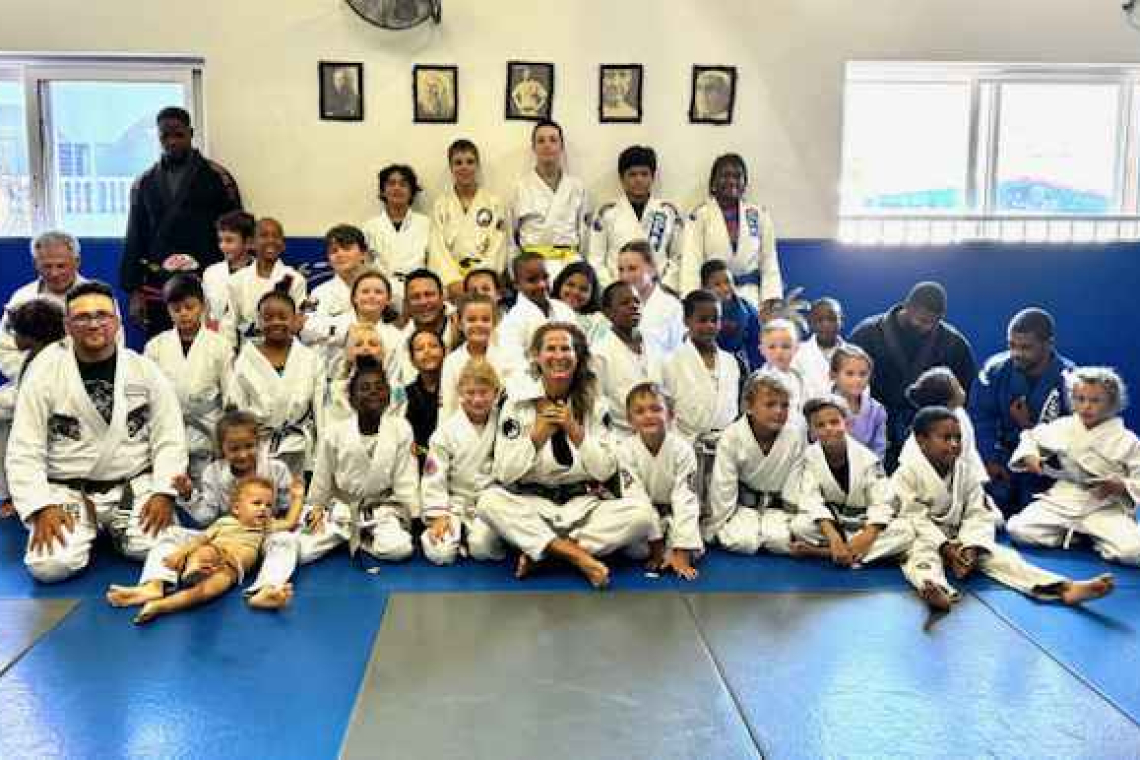Brazilian Jiu Jitsu students receive their black belts 